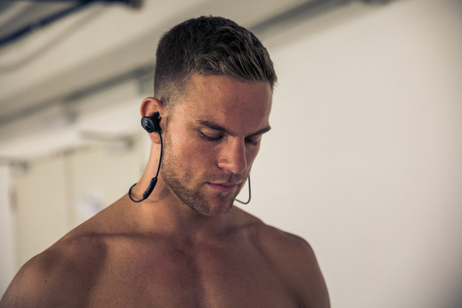 man wearing black earbuds